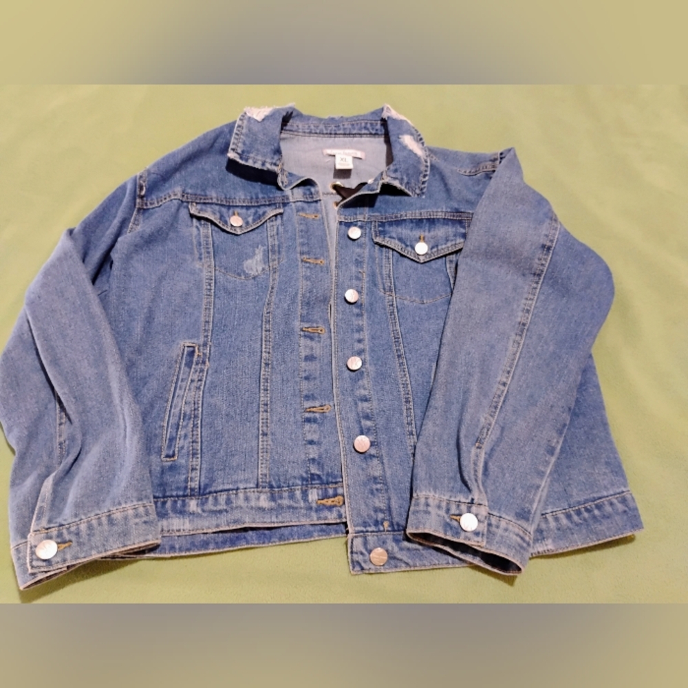 Distressed denim jacket with ribbon decor on the back